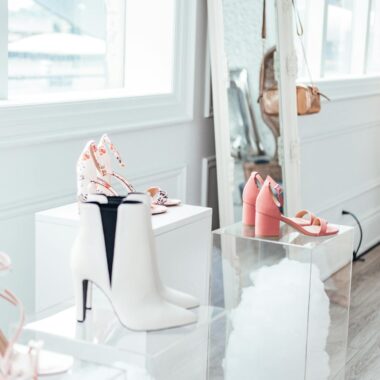 Modern shoe collection elegantly displayed in a chic boutique with natural lighting.